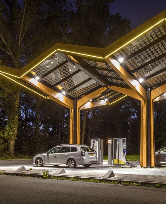 EV charging station at night with neon lights portrait
