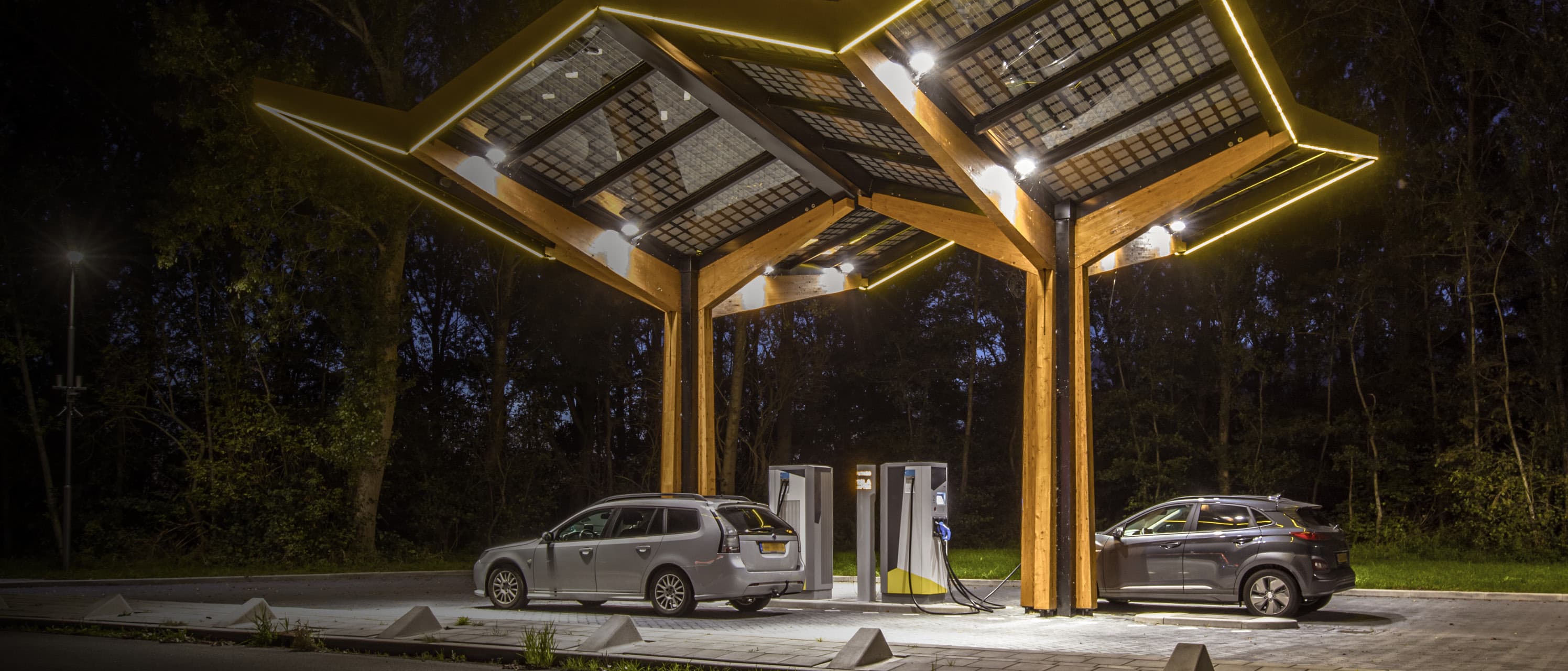 EV charging station at night with neon lights landscape