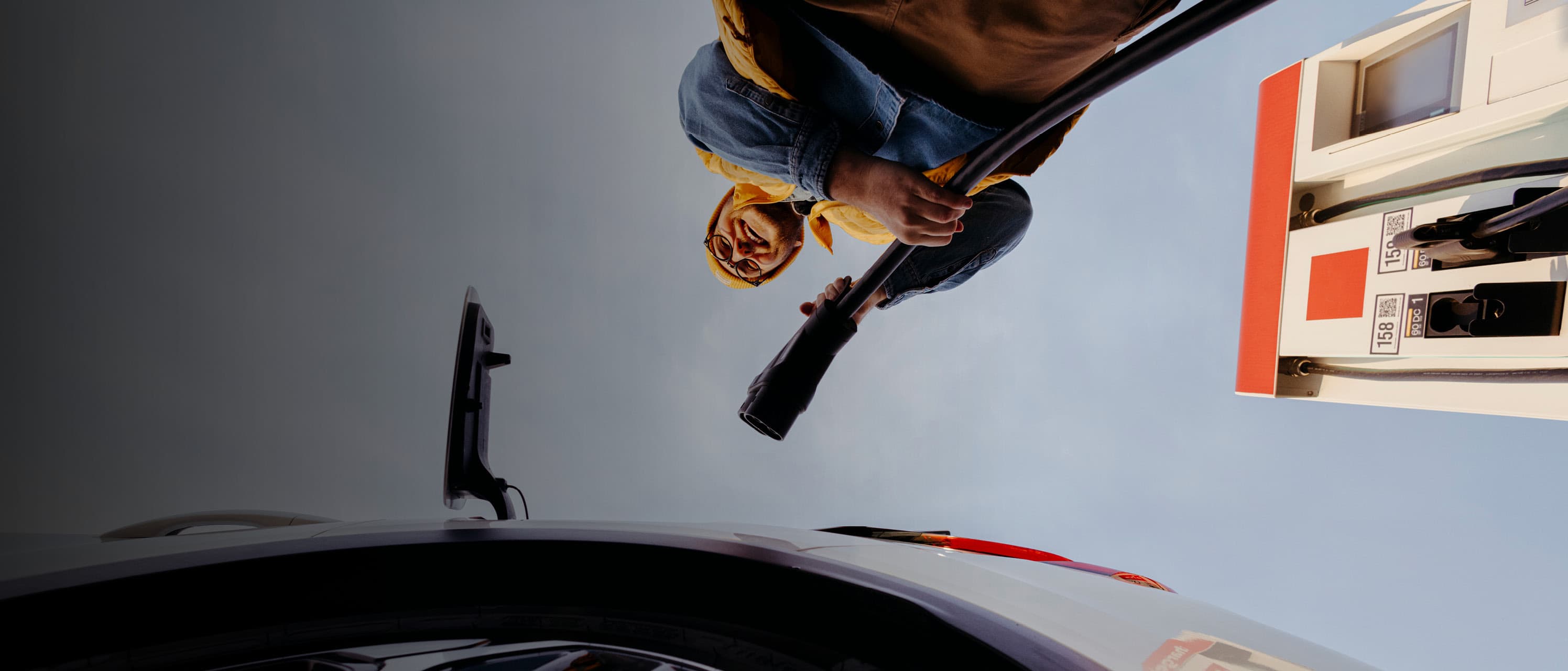 Man charging with cable POV from ground up landscape